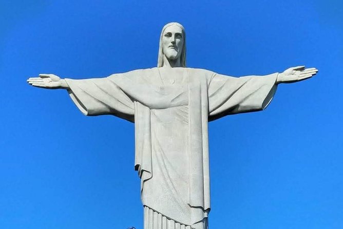 Cristo Redentor + City Tour: Transfers, Local Guide and Tickets. - Reaching Christ the Redeemer with the ticket handled