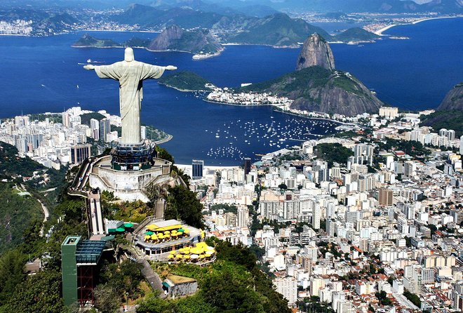 The Corcovado statue with Sugarloaf and the bay behind it
