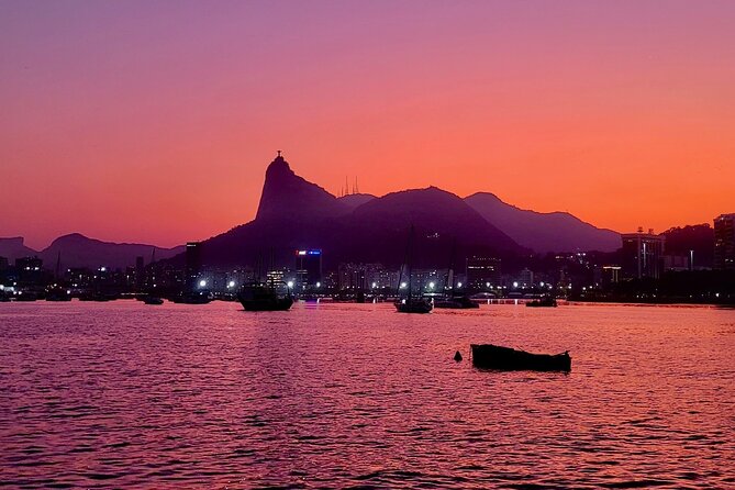 Shared Tour in Vela Catamaran - Velas do Rio - Returning past Santos Dumont Airport at sunset