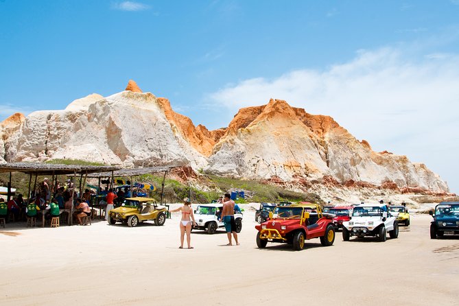 The colorful sands of Morro Branco beach - Full Day Tour - Afternoon choices: beach time, buggy ride, or jaganda